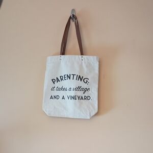 White Canvas Graphic Tote Bag About Parenting with Slightly Worn Brown Straps